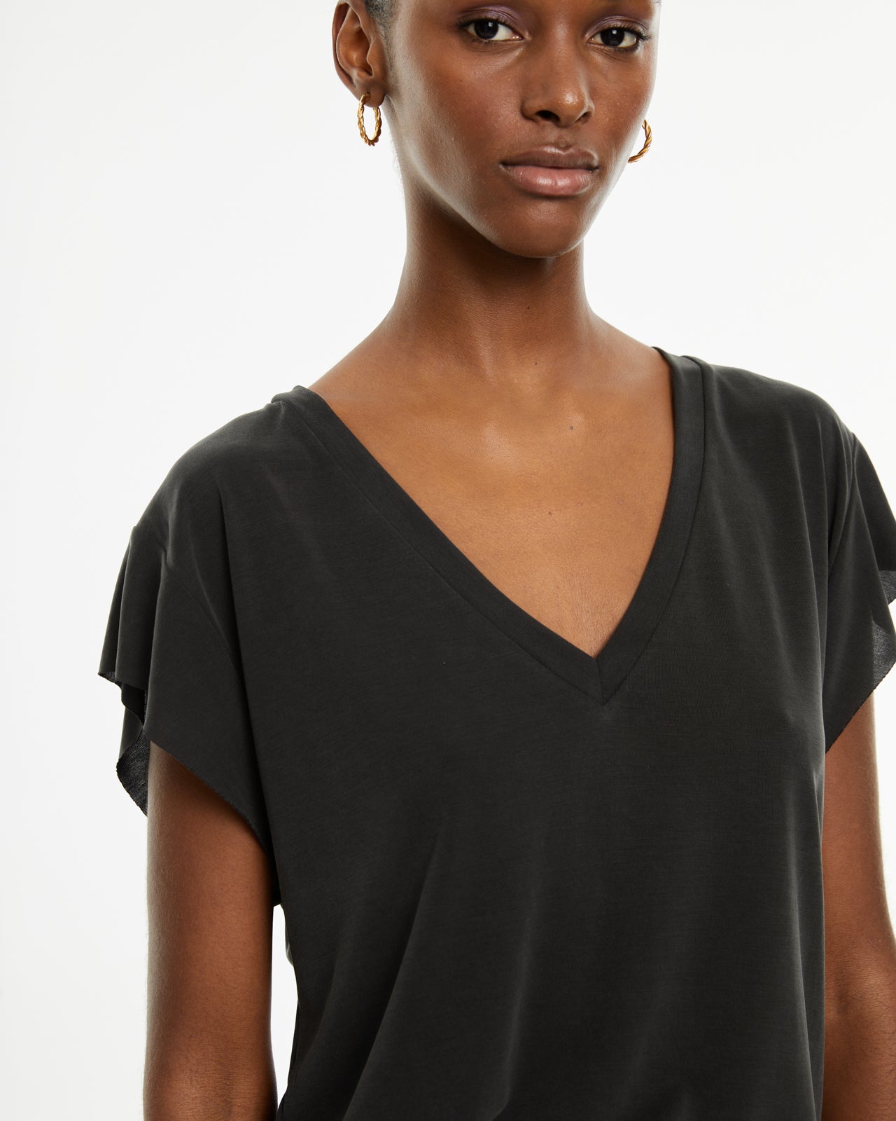 Camiseta fluida oversize escote pico sin mangas