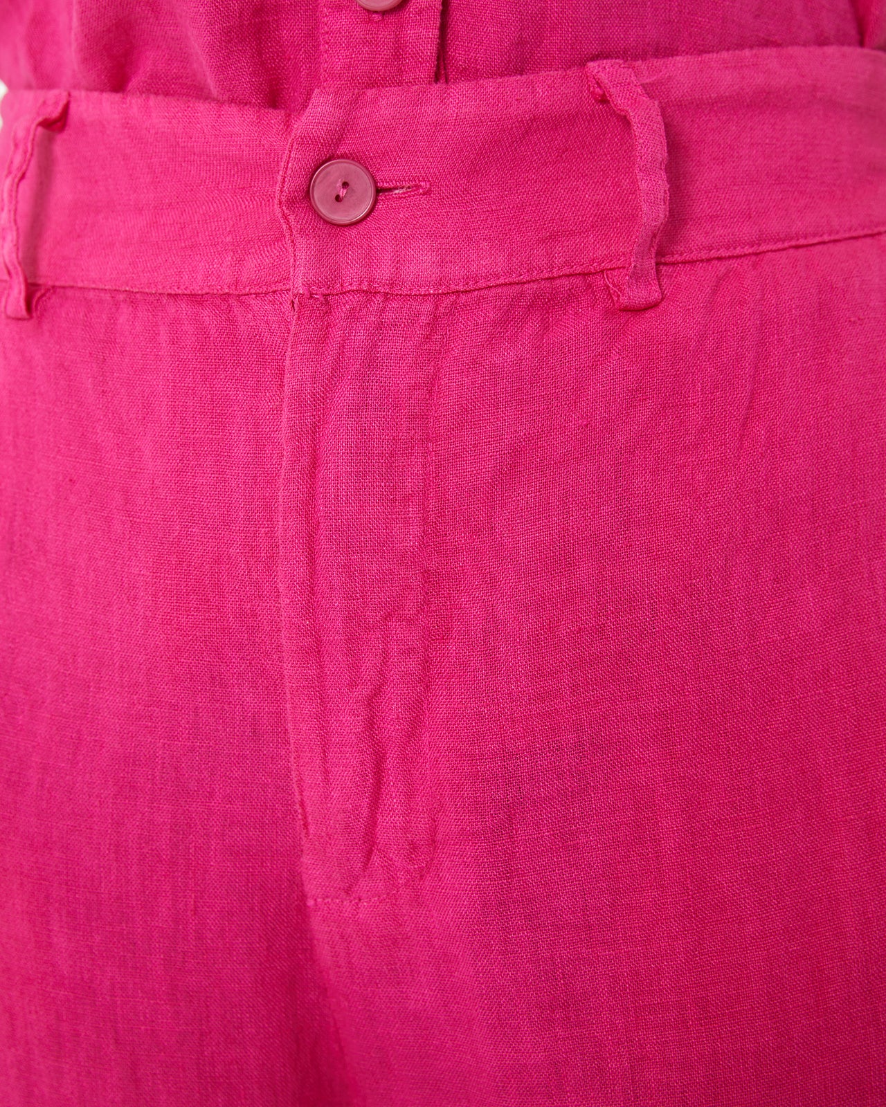 Pantalón de lino con cierre cremallera y botón