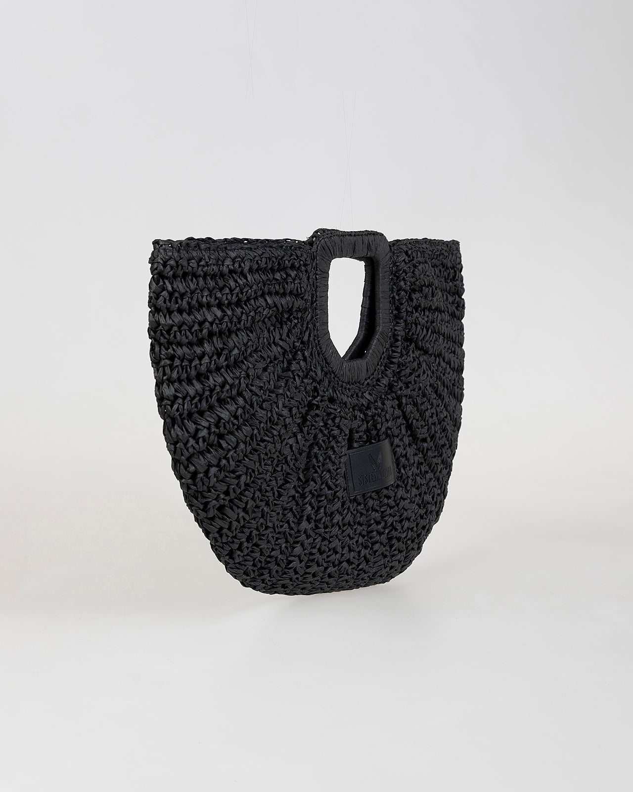 Bolso media luna trenzado